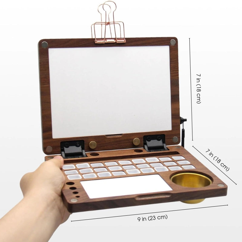 Open walnut watercolor box with size labels, 9 x 7 inches, empty paint grid and brass water pot
